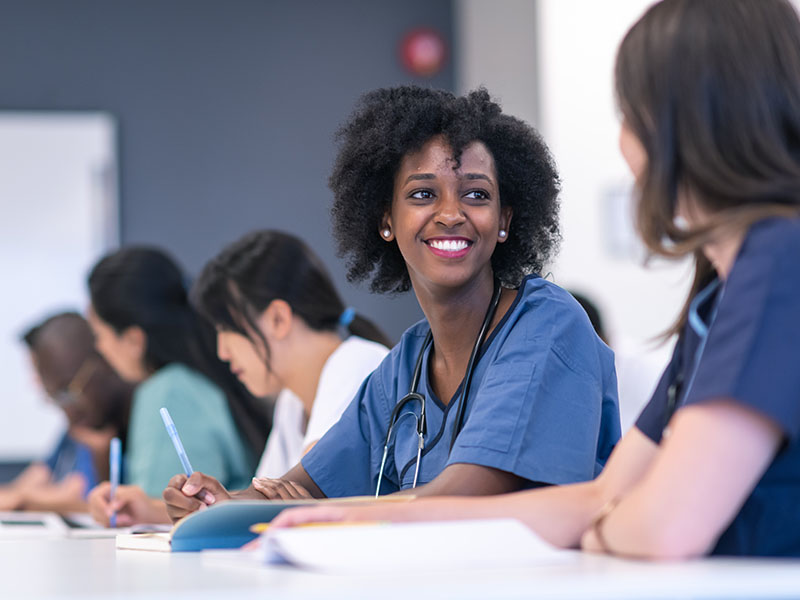 Nurses sitting at a table